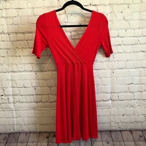 Red/Orange V cut dress.